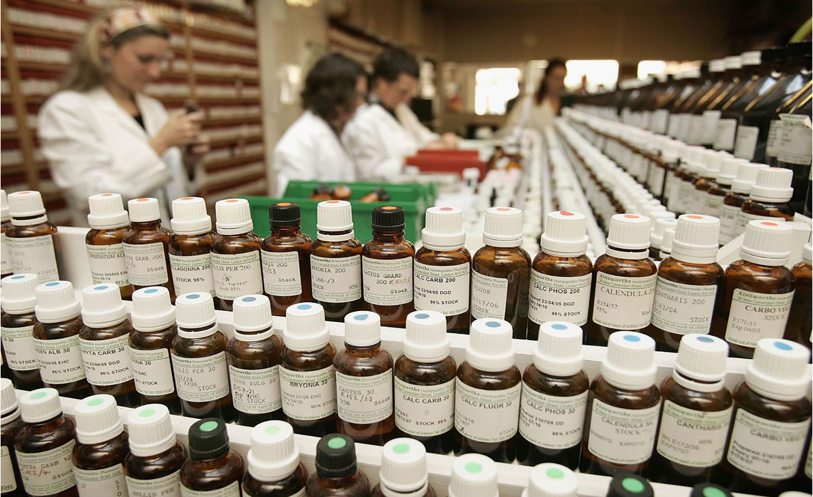 Rows of various homeopathic medicines